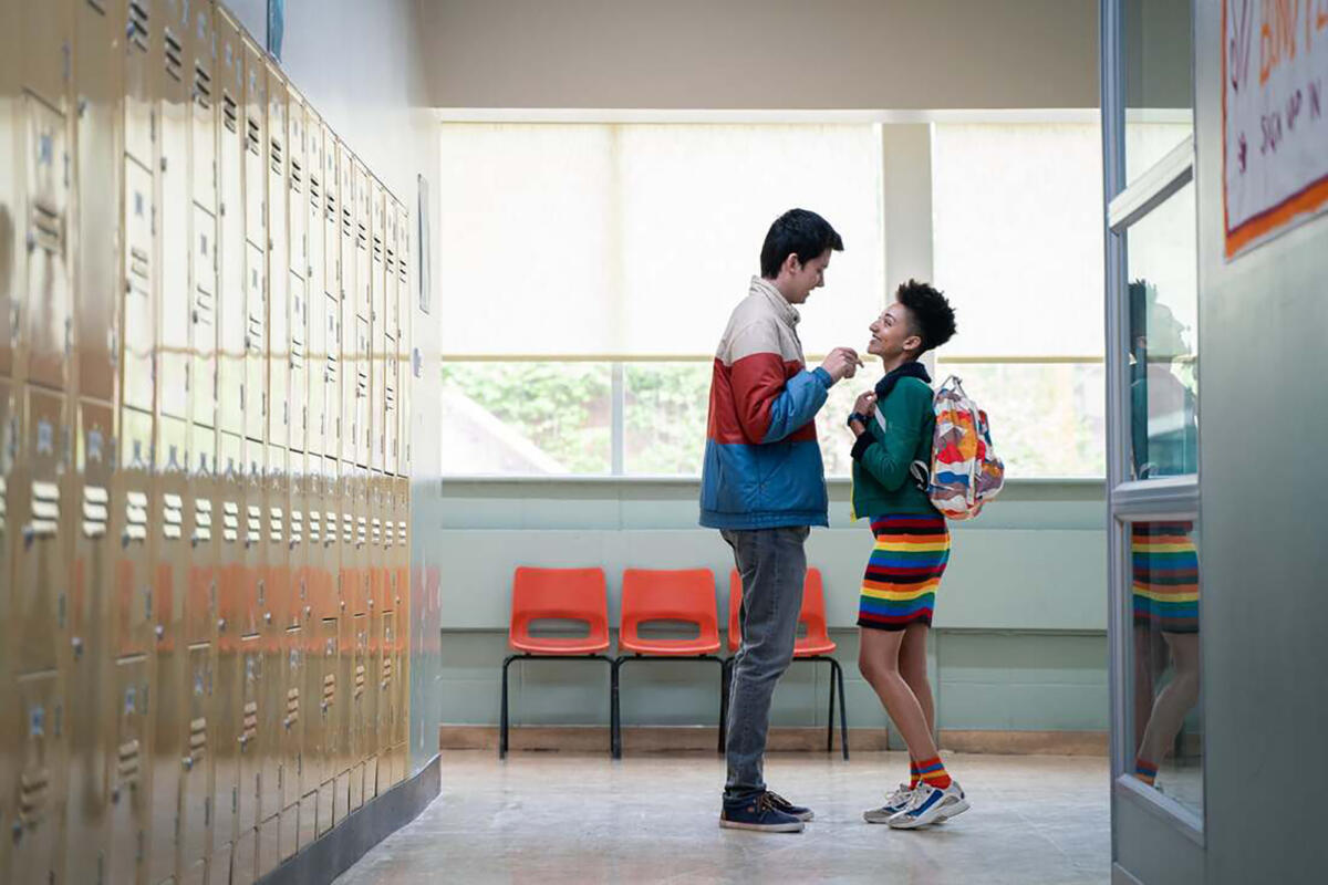 teen couple in school corridor