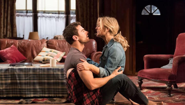 film still of actors in intimate embrace