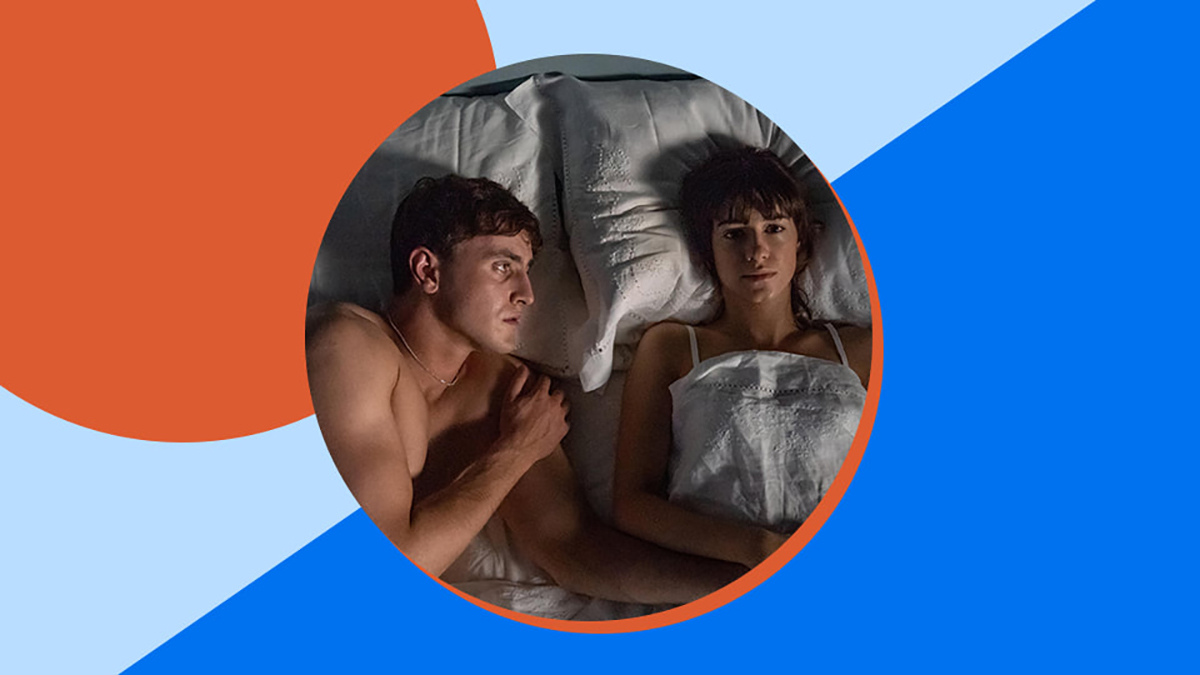 film still of actors in intimate embrace