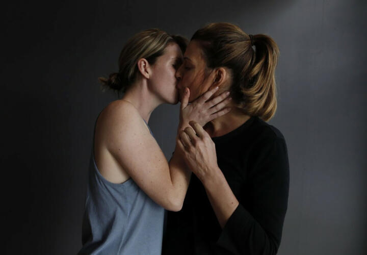 film still of actors kissing