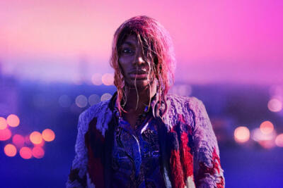 dramatic head and shoulders portrait against city lights